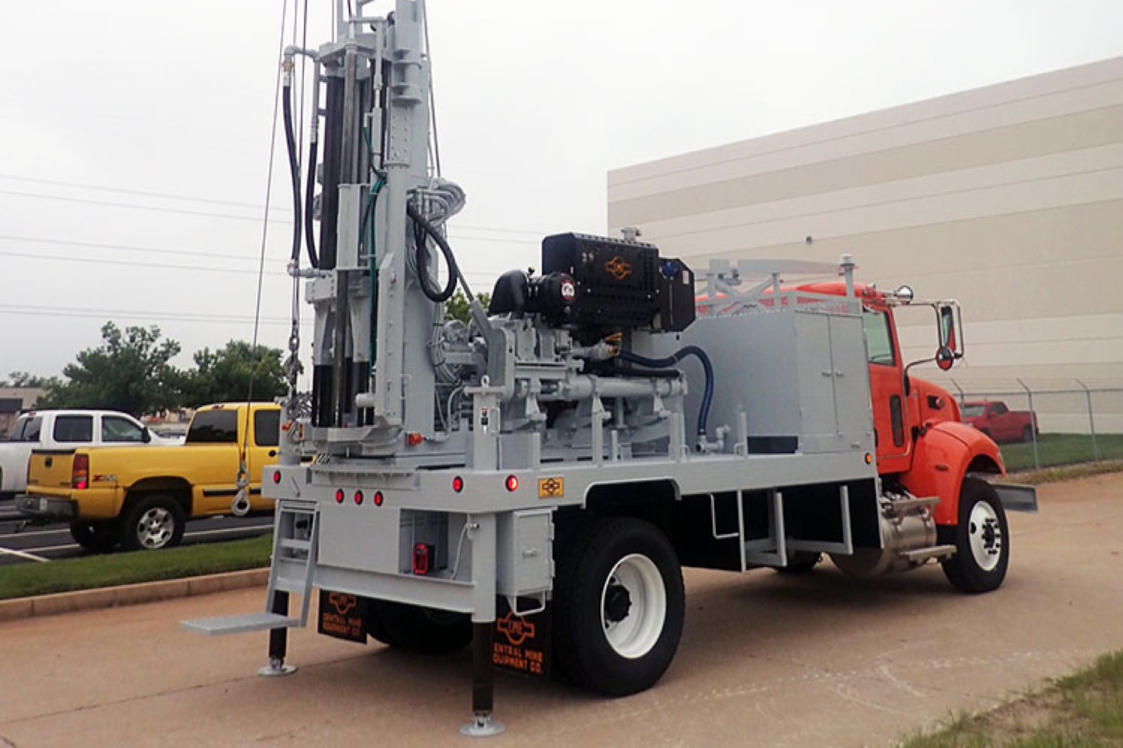 Truck-mounted drill rig at a job site