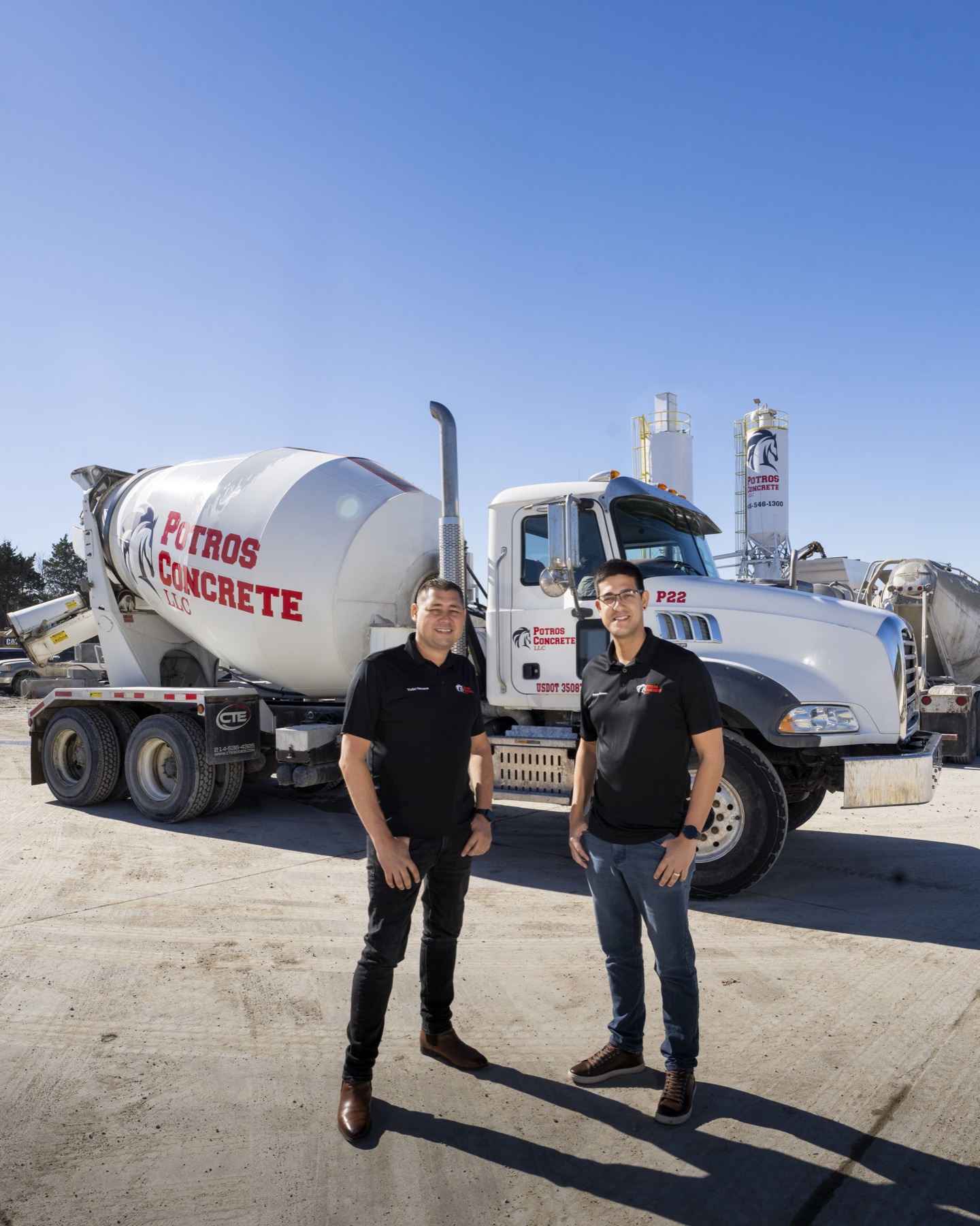 Yudiel and Reinier in front of a Potros mixer truck