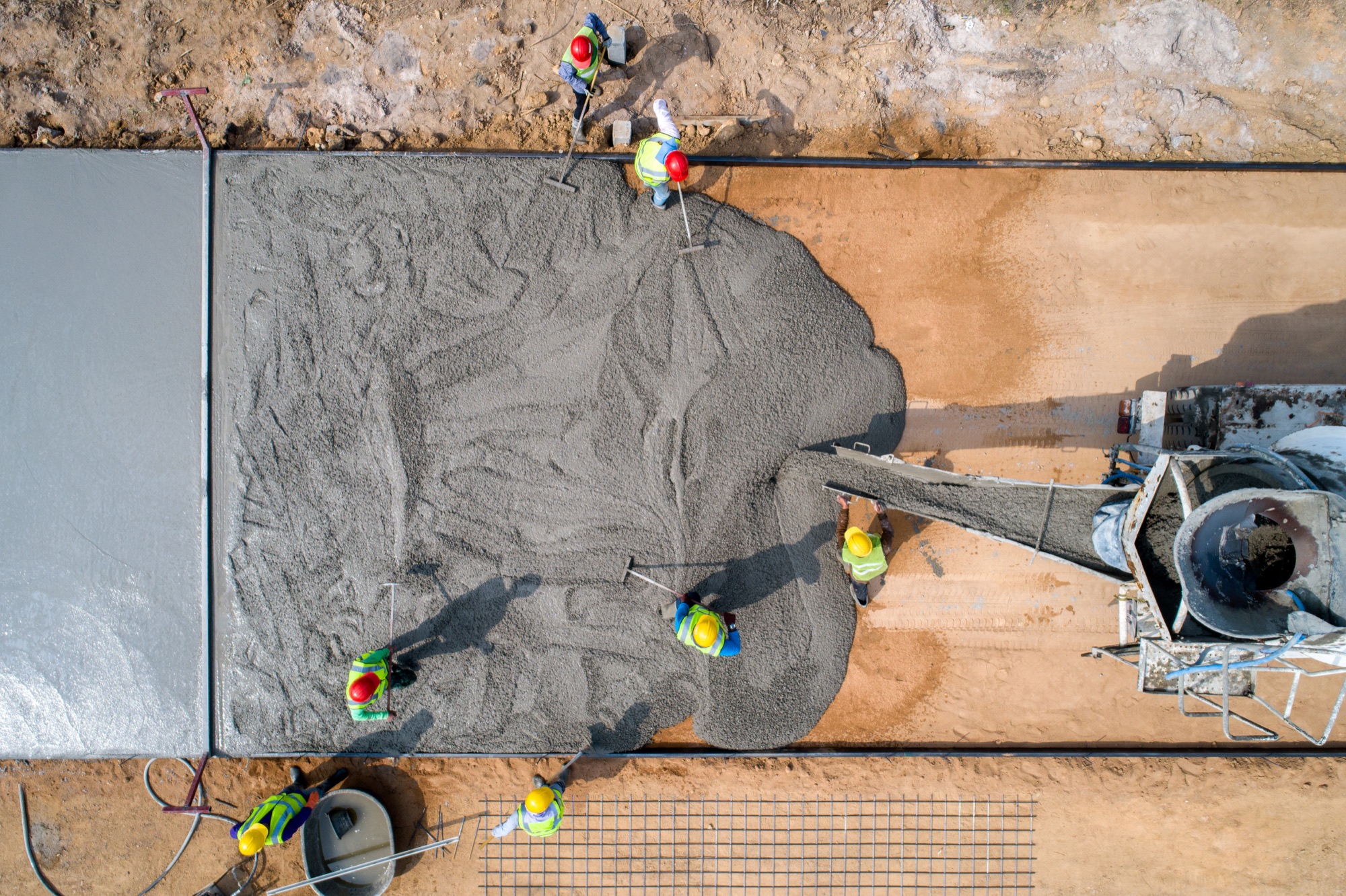 Crew pouring a subdivision street in Wylie