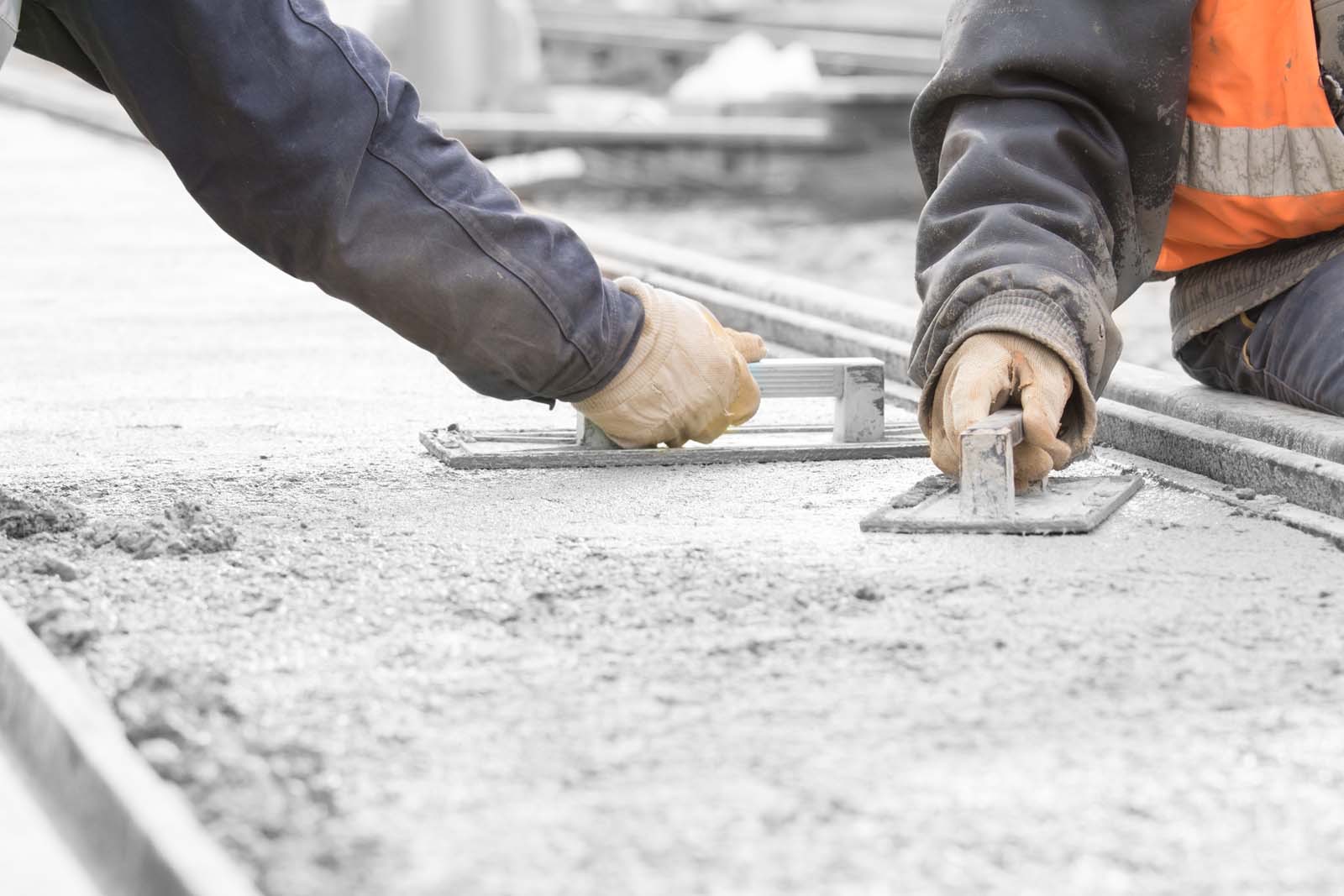 Finishers troweling a residential slab